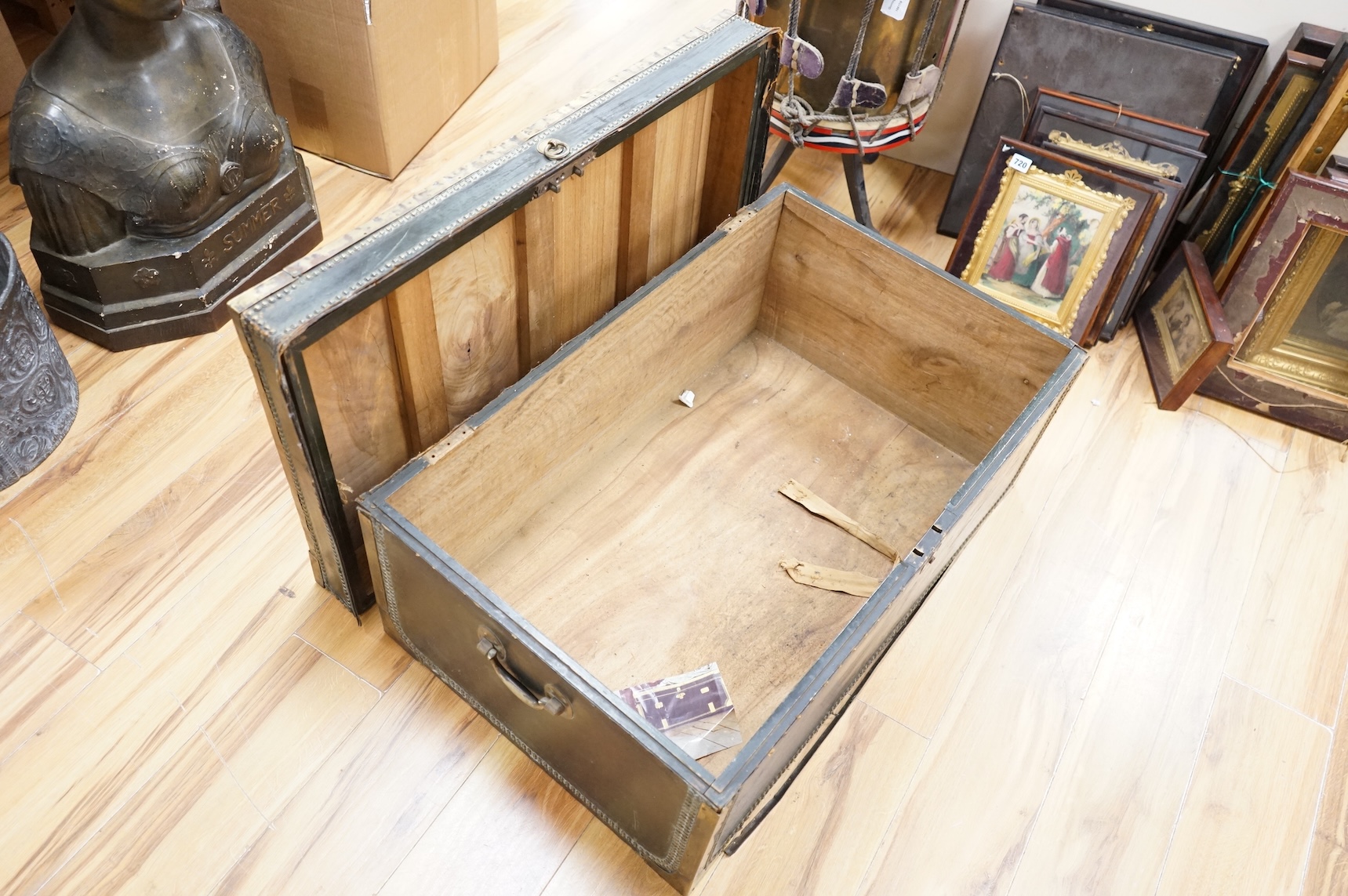 A 19th century Anglo Chinese camphor lined leather and brass studded trunk, lid detached, 85cm wide